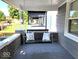 Charming front porch with a relaxing porch swing and decorative throw pillows at 1046 Nelson Ave, Indianapolis, IN 46203