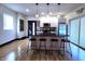 Modern kitchen with stainless steel appliances, a black countertop island, and a brick accent wall at 1046 Nelson Ave, Indianapolis, IN 46203
