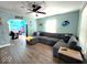 Stylish living room featuring an over-sized sectional sofa, ocean-themed decor, and wood-look flooring for cozy relaxation at 1046 Nelson Ave, Indianapolis, IN 46203