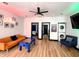 Open-concept living room features stylish seating and a foosball table and washer/dryer unit at 1046 Nelson Ave, Indianapolis, IN 46203