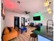 Open-concept living room features kitchen island, stylish seating, and a foosball table at 1046 Nelson Ave, Indianapolis, IN 46203