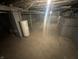 Spacious basement with water tank and concrete floor, ready for storage or customization at 1105 Winfield Ave, Indianapolis, IN 46222