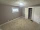 Cozy bedroom with plush carpeting, natural light, and ample closet space at 1105 Winfield Ave, Indianapolis, IN 46222