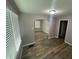 Comfortable dining room with neutral walls, wood-look floors, and a view to the living area at 1105 Winfield Ave, Indianapolis, IN 46222