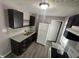Efficient kitchen featuring dark cabinets, granite countertops, and modern appliances at 1105 Winfield Ave, Indianapolis, IN 46222