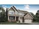 Beautiful two-story home featuring a brick and shingle exterior, attached two-car garage, and manicured landscaping at 11542 Aubrey Ln, Fishers, IN 46040