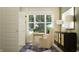 Inviting home office featuring a comfortable chair, desk, natural light, and stylish decor at 11542 Aubrey Ln, Fishers, IN 46040