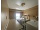 A laundry room with a countertop, utility sink, a window, and a washer and dryer at 1318 W 31St St, Indianapolis, IN 46208