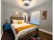 Cozy bedroom featuring a wooden bed frame and stylish decor at 1328 E Minnesota St, Indianapolis, IN 46203