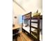 Efficient bedroom featuring a bunk bed and desk space, maximizing space and functionality at 1328 E Minnesota St, Indianapolis, IN 46203