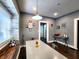 Bright dining area with a long table, window seating and modern decor at 1328 E Minnesota St, Indianapolis, IN 46203