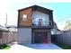 Modern two-story home with a balcony and garage, showcasing a contemporary design at 1328 E Minnesota St, Indianapolis, IN 46203