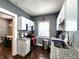 Modern kitchen with white cabinets, stainless steel appliances, and granite countertops at 1328 E Minnesota St, Indianapolis, IN 46203