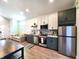 Well-lit kitchen with modern stainless steel appliances at 1328 E Minnesota St, Indianapolis, IN 46203