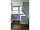 The laundry features a stackable washer and dryer with natural light at 1328 E Minnesota St, Indianapolis, IN 46203