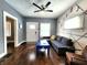 Stylish living room with hardwood floors, a comfortable gray sofa, and unique musical decor at 1328 E Minnesota St, Indianapolis, IN 46203