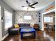 Cozy living room featuring hardwood floors and a wall with musical accents at 1328 E Minnesota St, Indianapolis, IN 46203