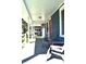 Covered porch with chairs, offering a relaxing outdoor space at 1328 E Minnesota St, Indianapolis, IN 46203