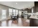 Eat-in kitchen with stainless steel appliances, dark cabinets, and a breakfast table at 14026 E End Rd, Fishers, IN 46037