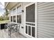 Outdoor patio seating area with a view of backyard and nature at 14026 E End Rd, Fishers, IN 46037