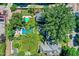Bird's eye view of multiple properties, each boasting beautiful backyard pools and mature trees at 1409 N Park Ave, Indianapolis, IN 46202