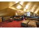 Stylish attic area featuring comfortable seating, custom storage, and vintage decor at 1409 N Park Ave, Indianapolis, IN 46202