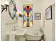 Bright white bathroom featuring a clawfoot tub and a stained glass window at 1409 N Park Ave, Indianapolis, IN 46202