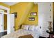 Bright and sunny bedroom with a unique geometric wallpaper accent wall and classic architecture at 1409 N Park Ave, Indianapolis, IN 46202