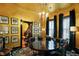 Chandelier hangs over the dining room, showing view to the staircase at 1409 N Park Ave, Indianapolis, IN 46202