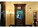 Elegant entryway showcasing a dark wood door with a window view of outdoor greenery at 1409 N Park Ave, Indianapolis, IN 46202