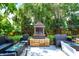 Outdoor fireplace with comfortable seating, and stylish landscaping at 1409 N Park Ave, Indianapolis, IN 46202