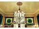 Close-up view of the ornate gas fireplace with stained glass windows and period lighting at 1409 N Park Ave, Indianapolis, IN 46202