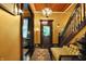 Elegant foyer features a hardwood floor, staircase, and vintage decor at 1409 N Park Ave, Indianapolis, IN 46202