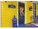 Charming yellow home with classic front door and decorative details at 1409 N Park Ave, Indianapolis, IN 46202