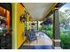 Relaxing front porch with stylish seating and decorative hanging plants at 1409 N Park Ave, Indianapolis, IN 46202