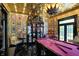 Luxurious game room with pink pool table, detailed ceiling, and vintage decor at 1409 N Park Ave, Indianapolis, IN 46202