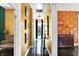 Elegant hallway features rich wall colors, decorative lighting, and framed artwork leading to stylishly designed rooms at 1409 N Park Ave, Indianapolis, IN 46202