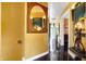 Hallway showcases elegant lighting and decor, leading to inviting spaces, enhancing the home's classic charm at 1409 N Park Ave, Indianapolis, IN 46202