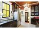 This kitchen features stainless steel appliances and a double bowl sink with a view from the window above at 1409 N Park Ave, Indianapolis, IN 46202