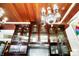 Dark wood cabinets stretch to the ceiling, accented with a gorgeous chandelier and stained glass window at 1409 N Park Ave, Indianapolis, IN 46202