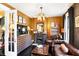 Inviting living room showcasing fireplace, plush seating, stylish furnishings, and a glimpse into the adjacent bedroom at 1409 N Park Ave, Indianapolis, IN 46202