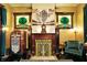 Luxurious living room boasts a vintage jukebox, fireplace, and stained glass windows at 1409 N Park Ave, Indianapolis, IN 46202