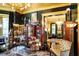 Living room with home bar featuring a black and gold color scheme and stained glass decor at 1409 N Park Ave, Indianapolis, IN 46202