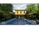 A lovely pool with lounge seating and a yellow two-story building in the background at 1409 N Park Ave, Indianapolis, IN 46202