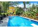 Stunning backyard pool with diving board, lounge chairs, and elegant landscaping at 1409 N Park Ave, Indianapolis, IN 46202
