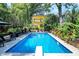 Inviting pool area with crystal clear water, ample seating, and lush landscaping for ultimate relaxation at 1409 N Park Ave, Indianapolis, IN 46202