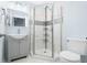 Bathroom featuring a modern vanity, framed mirror, and tiled shower at 150 W Jo Jo Ln, Nineveh, IN 46164