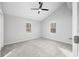 Bright bedroom with neutral carpet, vaulted ceiling with ceiling fan, and two windows at 150 W Jo Jo Ln, Nineveh, IN 46164
