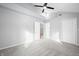 Spacious bedroom with vaulted ceiling, modern fan, and ensuite bathroom at 150 W Jo Jo Ln, Nineveh, IN 46164
