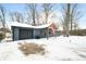 Front exterior view of a single story home with attached garage in a snow covered yard at 150 W Jo Jo Ln, Nineveh, IN 46164